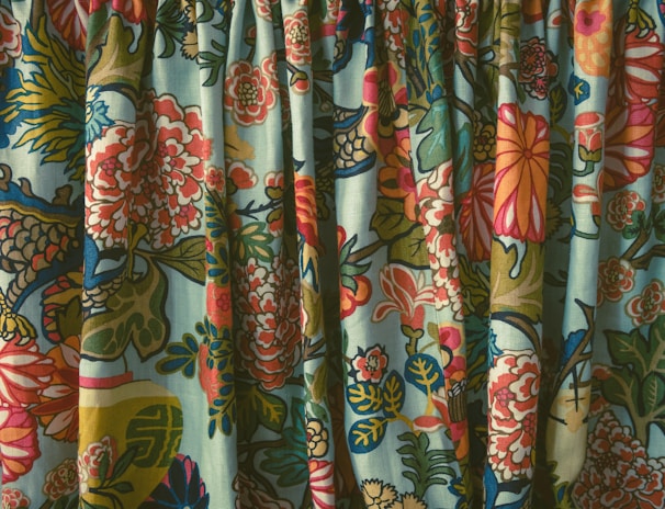 Close-up of a Jaipur hand block printed fabric with intricate floral patterns in vibrant colors.